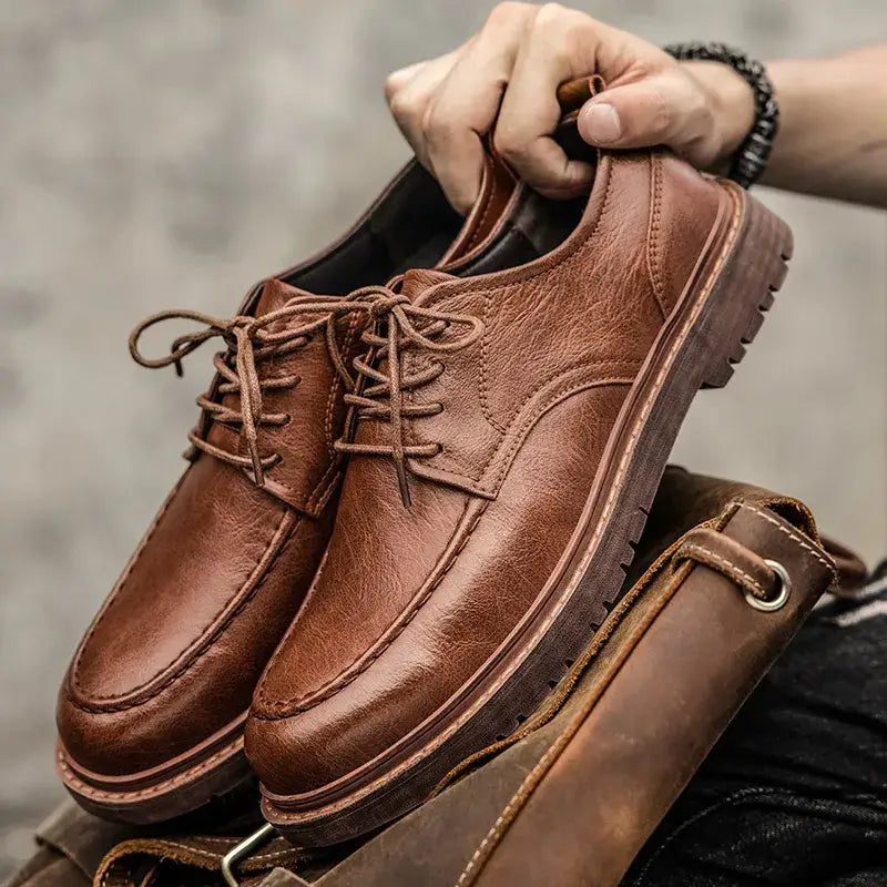 Brown leather oxford-style shoe with moc-toe stitching from Banor erkek rugan collection