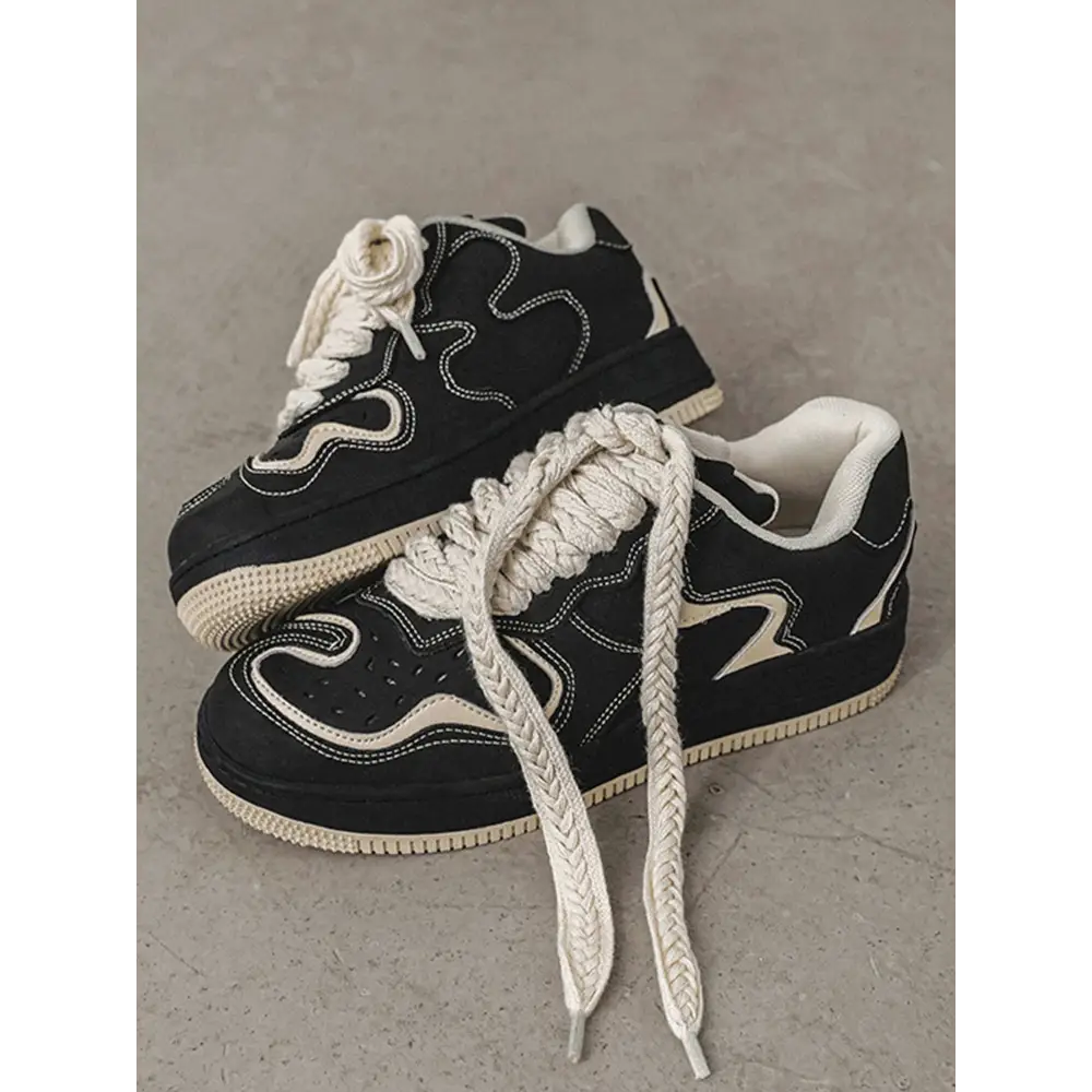 Janor unisex sneakers in black and white featuring thick rope-style laces