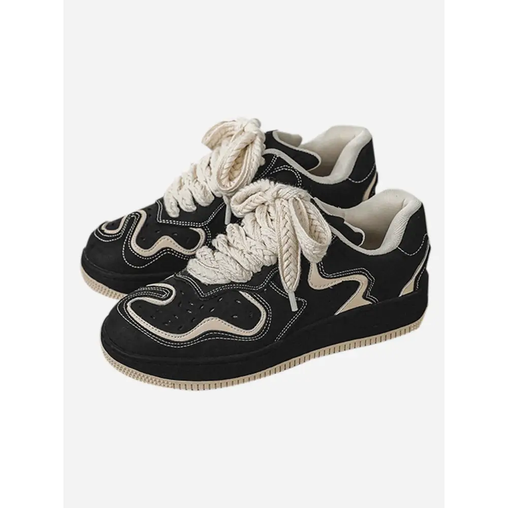 Janor unisex sneakers in black and white with wavy design patterns and cream laces