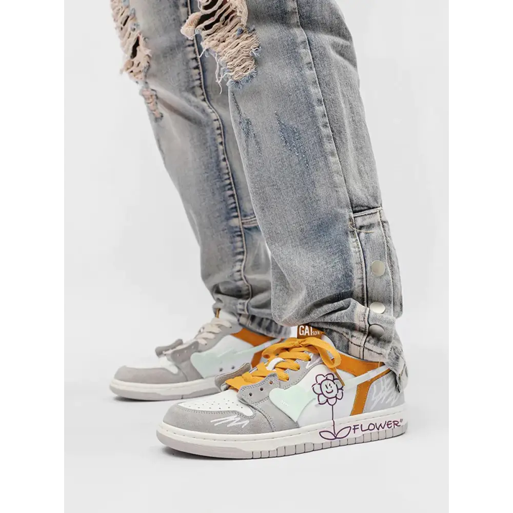 Melro kadın sneakers with distressed gray jeans and white sneakers featuring orange accents