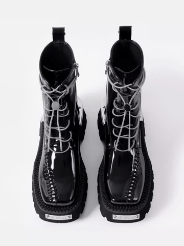 Drellin unisex bot with black combat-style boots featuring chunky soles and unique lacing