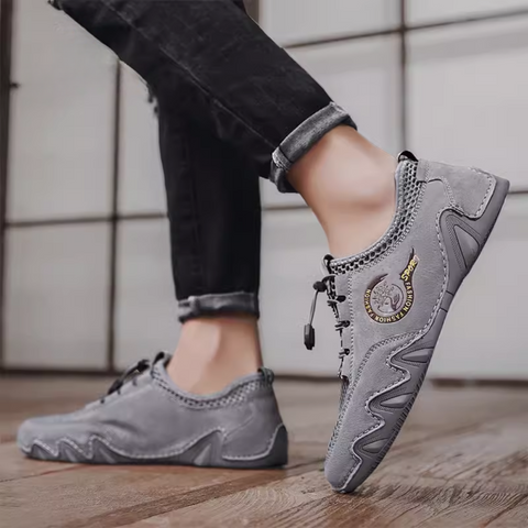 Gri Faldric günlük erkek sneaker, kıvrımlı tabanı ve sarı detaylarıyla dikkat çekiyor