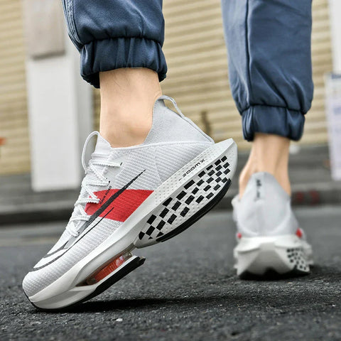 Terion sneakers with gray upper, red stripe, and checkered sole design için ayakkabı