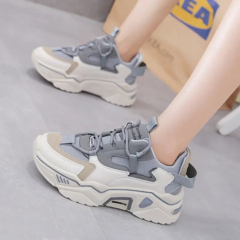 Rinaya Kadın Sneakers with a white and gray color scheme and unique textures