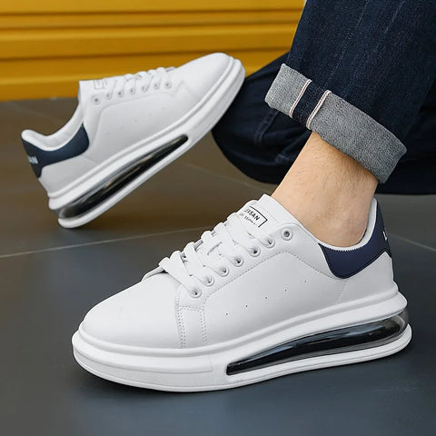 Astrix erkek sneakers featuring white design, navy blue heel accent, and thick sole