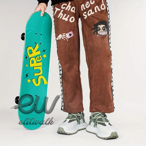 Teal Draxon skateboard deck with yellow SURF text and brown cartoon patch pants